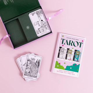 Color your own tarot card set with a book and cards on a pink background