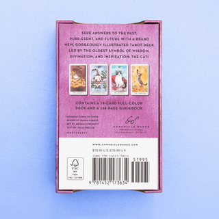 Back of a tarot card box with text and images on a light blue background
