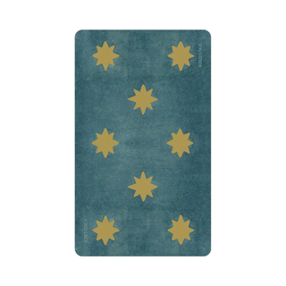 Teal rug with yellow star patterns on a white background