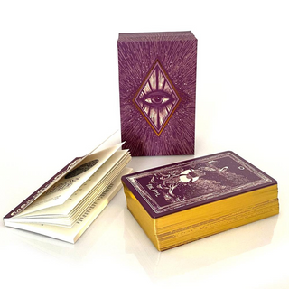 Purple and gold playing cards with an eye design on a white background
