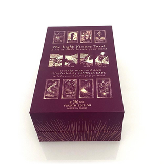 Purple tarot card box with illustrations and text on a white background