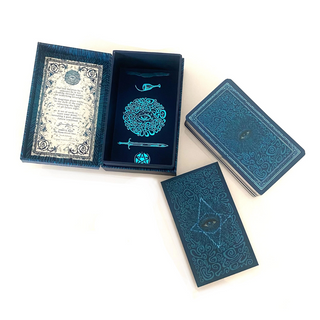 Blue playing cards with intricate designs on a white background
