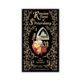 The Cover of Russian Tarot of St. Petersburg Deck with a man sitting at a desk and a gold, floral background