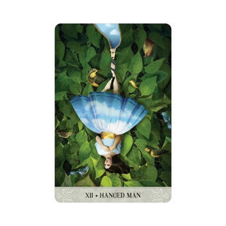Tarot card featuring 'Hanged Man' with a person in a blue dress hanging from a tree branch.
