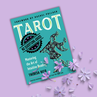 Book titled 'Tarot: No Questions Asked' on a purple background with flowers.