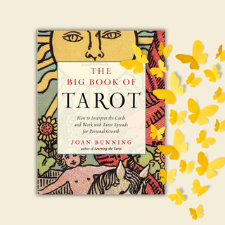 Book titled 'The Big Book of Tarot' with colorful cover design and yellow butterflies on a beige background
