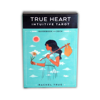 True Heart Intuitive Tarot guidebook and deck packaging with illustration of a woman holding a flower and bag against a blue sky.